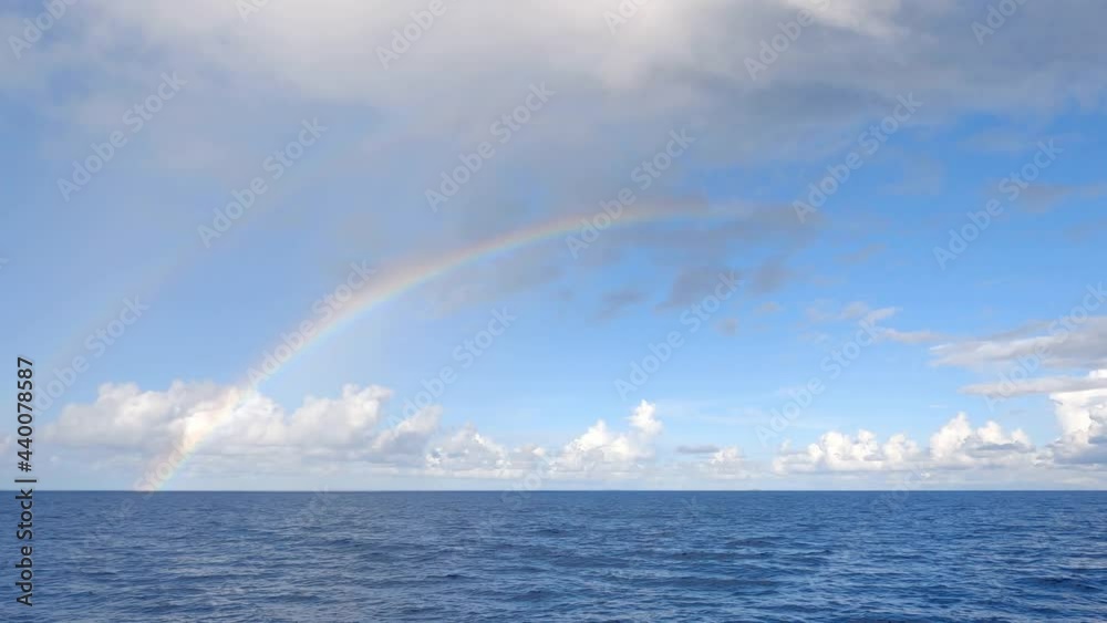 Two large rainbows in the open ocean in the Seychelles.