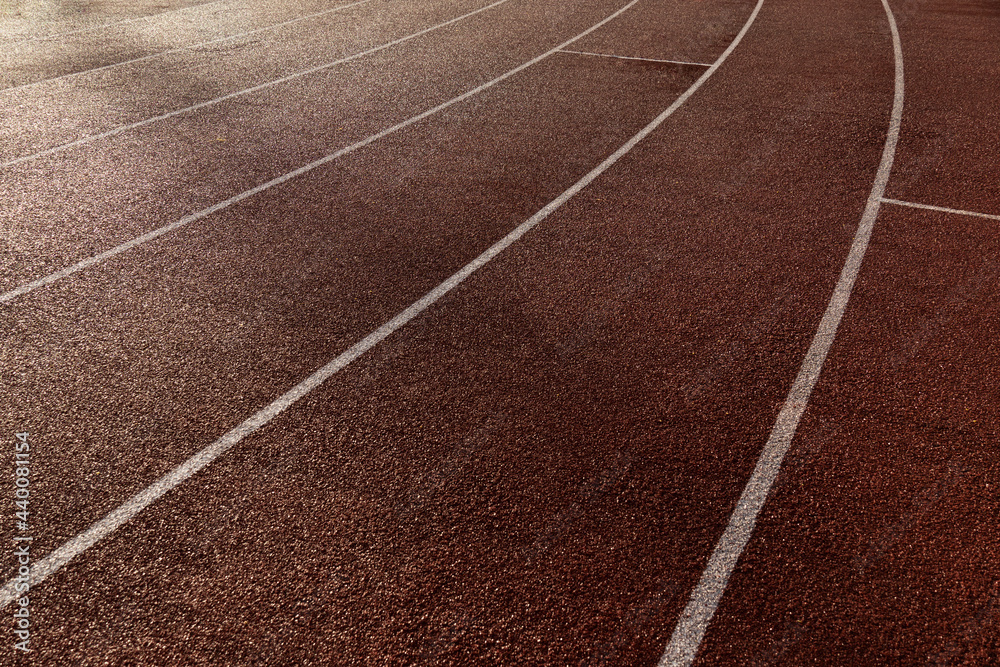 brown orange red running tract in sport stadium of for competition background