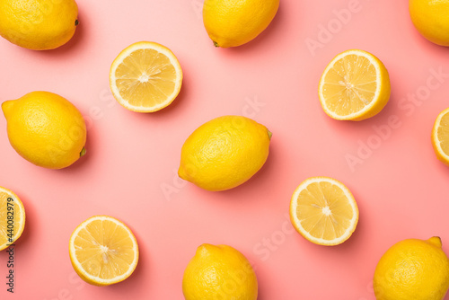 Wallpaper Mural Top view photo of halves and whole yellow lemons on isolated pastel pink background Torontodigital.ca