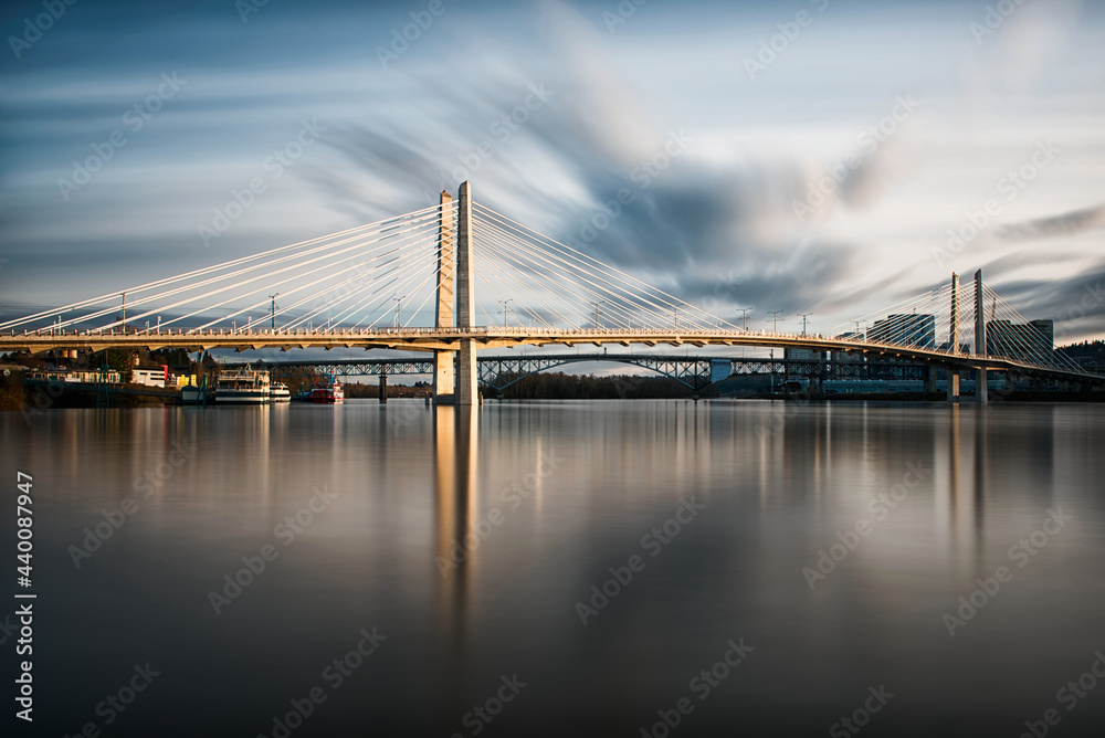 Long exposure of Tilikum Crossing Bridge over the Willamette River in Portland, Oregon with Clouds