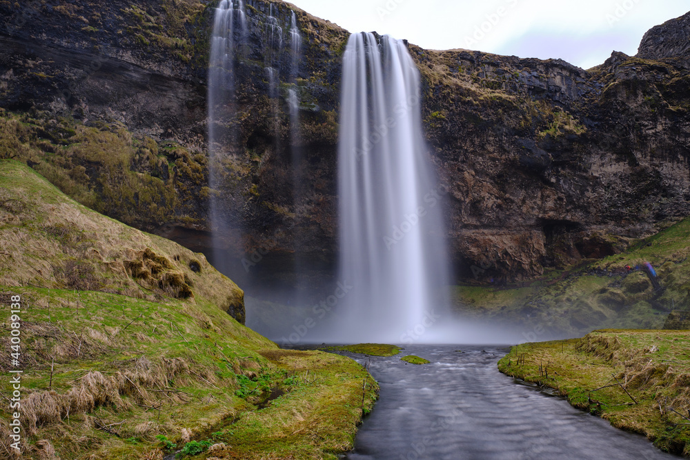 Seljalandsfoss falls in Iceland on a spring day with heavy water fall