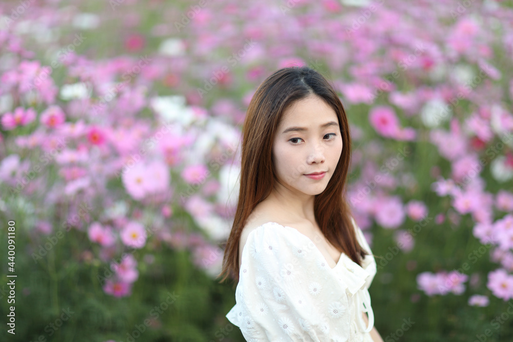 Beautiful young woman with white dress on garden background Beautiful young woman with white dress on garden background