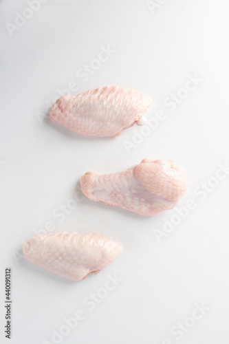 raw chicken wings white background. flat lay