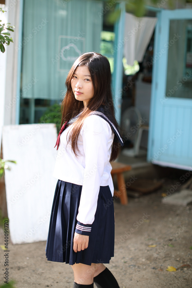 Fototapeta premium Japanese school girl in local coffee shop