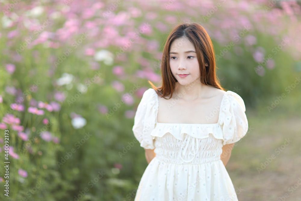 Beautiful young woman with white dress on garden background Beautiful young woman with white dress on garden background
