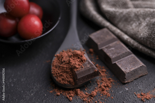 Photos stick spoon with powdered chocolate
