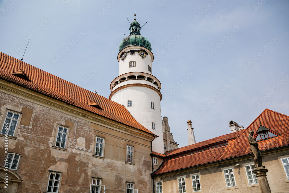 Baroque romantic castle Nove mesto nad Metuji with park, renaissance chateau, round white clock tower, red tile roof, Italian garden, summer sunny day, Eastern Bohemia, Czech Republic Baroque romantic castle Nove mesto nad Metuji with park, renaissance chateau, round white clock tower, red tile roof, Italian garden, summer sunny day, Eastern Bohemia, Czech Republic