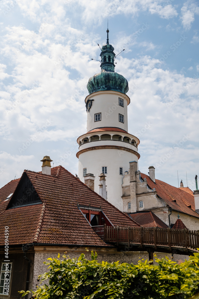 Baroque romantic castle Nove mesto nad Metuji with park, renaissance chateau, round white clock tower, red tile roof, Italian garden, summer sunny day, Eastern Bohemia, Czech Republic Baroque romantic castle Nove mesto nad Metuji with park, renaissance chateau, round white clock tower, red tile roof, Italian garden, summer sunny day, Eastern Bohemia, Czech Republic