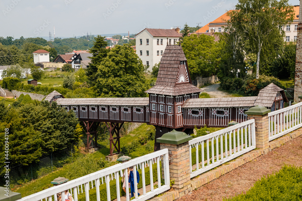 Wonderful covered wooden bridge by Dusan Jurkovic in Italian garden, baroque park in sunny summer day, renaissance chateau castle Nove mesto nad Metuji, Eastern Bohemia, Czech Republic Wonderful covered wooden bridge by Dusan Jurkovic in Italian garden, baroque park in sunny summer day, renaissance chateau castle Nove mesto nad Metuji, Eastern Bohemia, Czech Republic