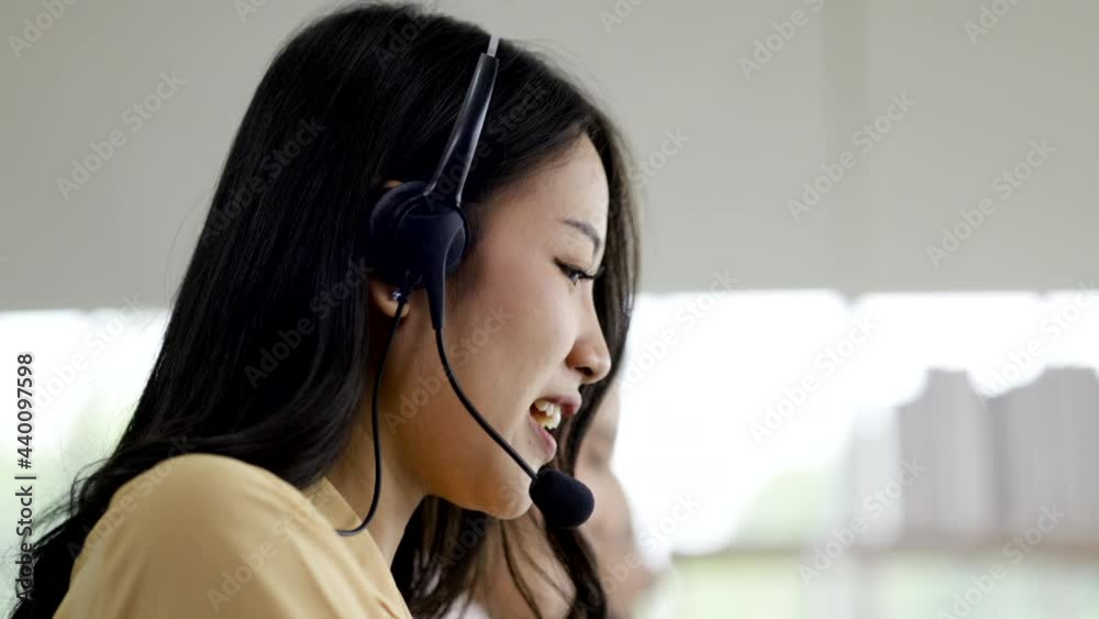 Call center Asian team wear headphones talk information service for customers via online. Group Service Operator Investment Consult Business Finance. Service mind to customer. communication technology Call center Asian team wear headphones talk information service for customers via online. Group Service Operator Investment Consult Business Finance. Service mind to customer. communication technology