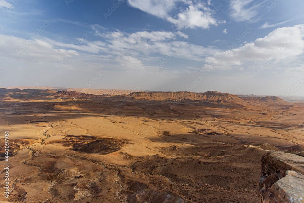 Ramon Crater Makhtesh Ramon, the largest in the world, as seen from the high rocky cliff edge surrounding it from the north, Ramon Nature reserve, Mitzpe Ramon, Negev desert, Israel. High quality