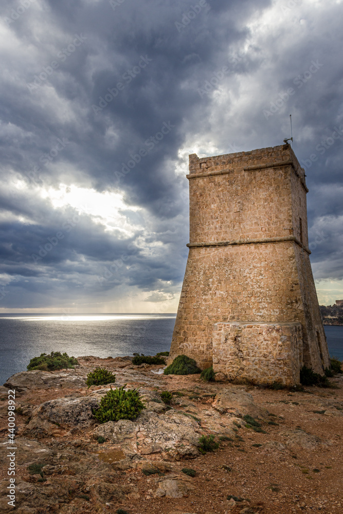 Great view and landscape of Malta joining the watchtowers with sunset