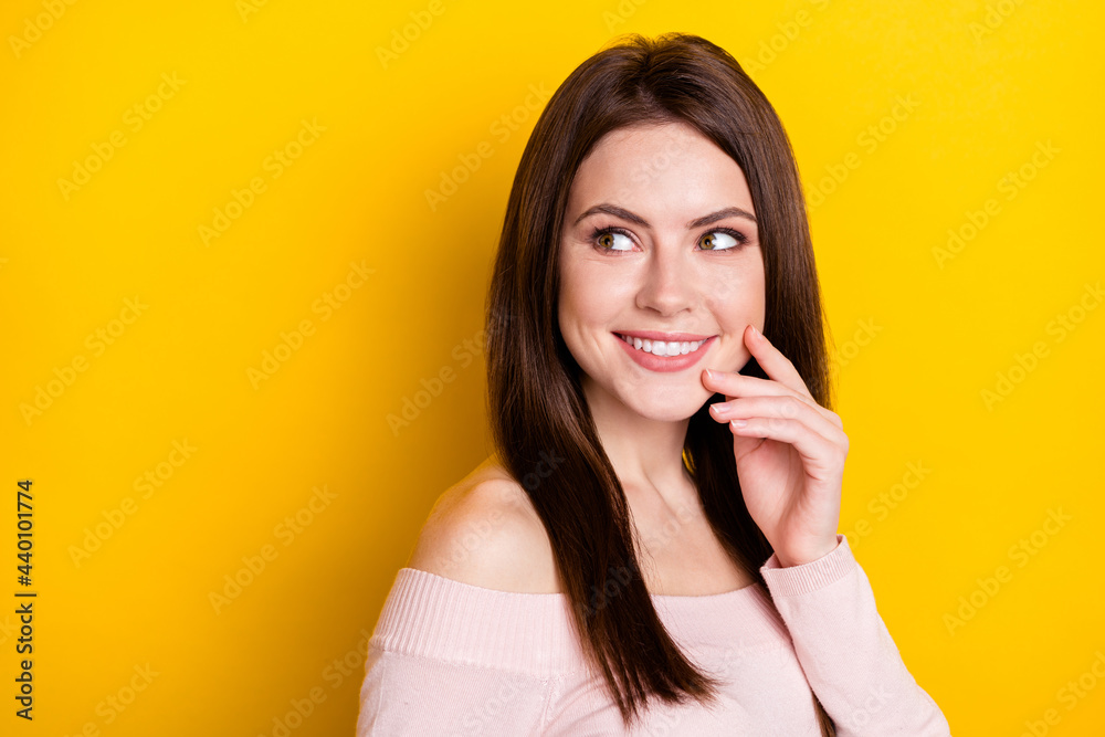 Photo of optimistic brunette lady look empty space wear pink shirt isolated on yellow color background Photo of optimistic brunette lady look empty space wear pink shirt isolated on yellow color background