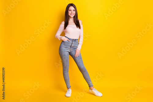 Full size photo of young happy good moo beautiful gorgeous woman posing on camera isolated on yellow color background