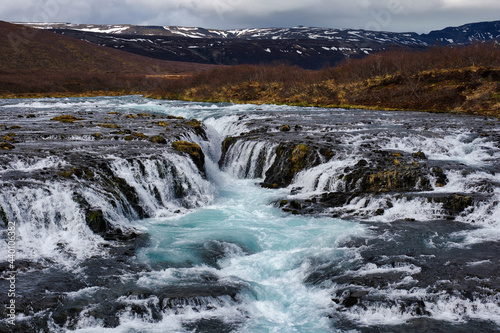 Bruarfoss waterfall in Iceland showing it s true blue colors on a cold spring day