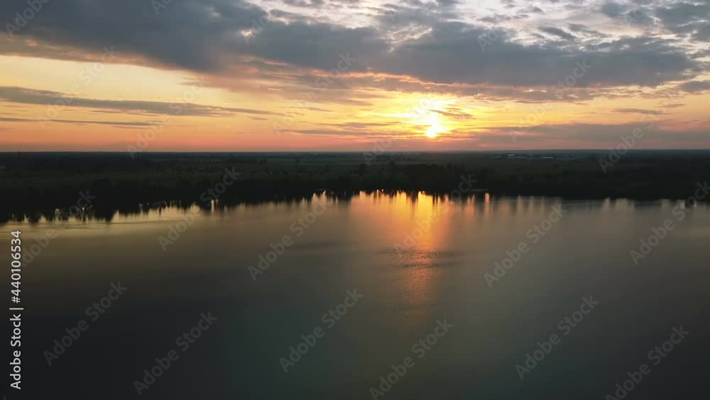 4K Aerial. Flight over lake in evening time with beautiful red sunlight. Landscape 4K Aerial. Flight over lake in evening time with beautiful red sunlight. Landscape