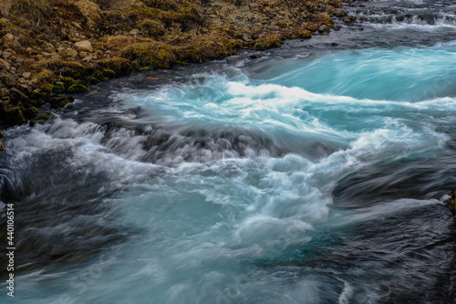 Bruarfoss waterfall in Iceland showing it's true blue colors on a cold spring day