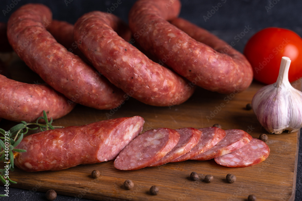 Sliced slices of homemade sausage. Homemade Krakow sausage