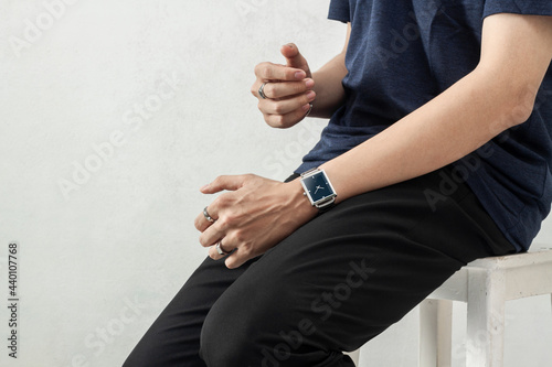 Young men wearing wrist watch in casual clothing lifestyle