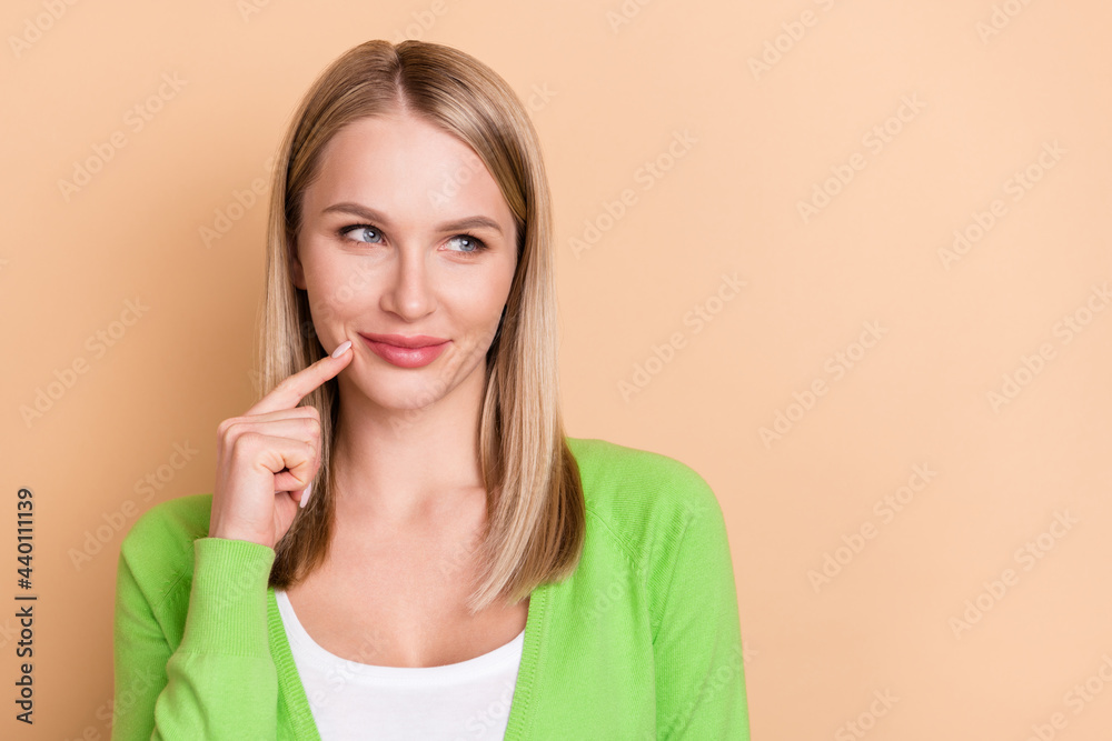 Portrait of attractive cunning girl thinking deciding copy blank space solution isolated over beige pastel color background Portrait of attractive cunning girl thinking deciding copy blank space solution isolated over beige pastel color background