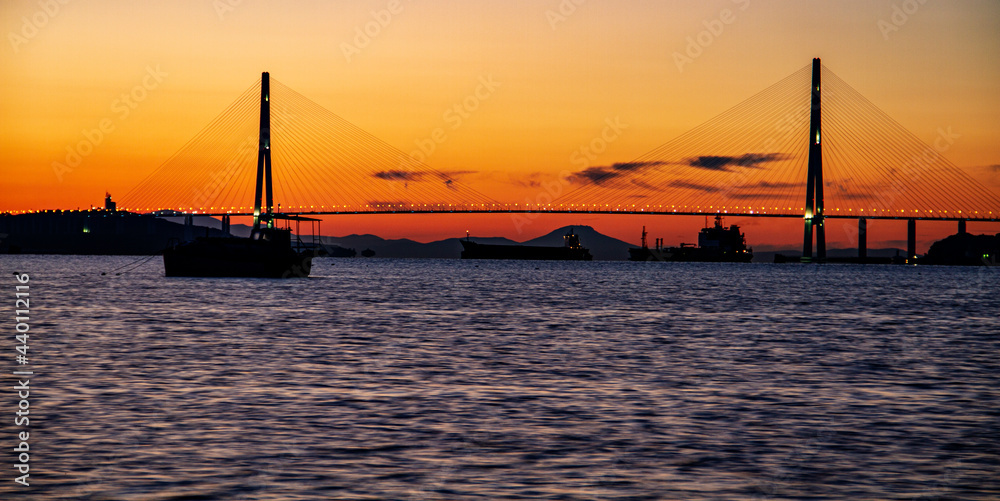 Fototapeta premium Early Morning view of 1,885m Russky Island Bridge in Russia, connects Russky Island with the city of Vladivostok. It is one of the longest cable-stayed suspension bridge in the world.