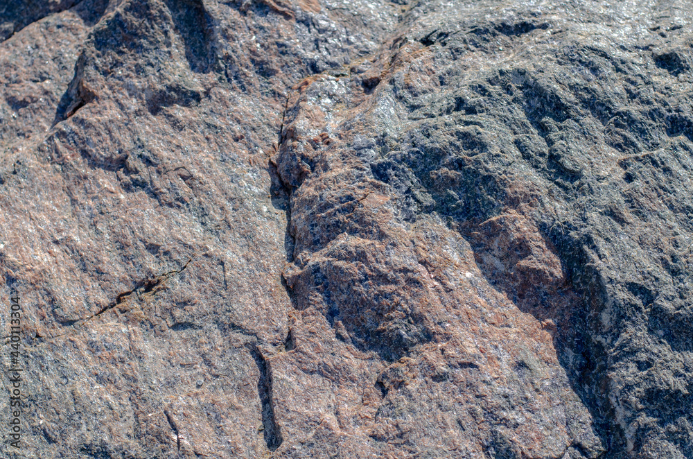 Rock. Granite. Large stones. The structure of the stone. Rock. Granite. Large stones. The structure of the stone.