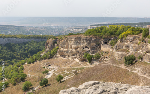Panorama of the ancient city carved in the rock in the Republic of Crimea . Beautiful view of the entire valley .