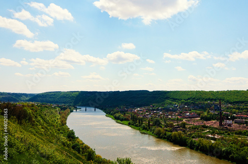 Picturesque spring aerial landscape view of canyon and Dnister River in the Zalishchyky town. Ternopil region, Ukraine. Blue sky background. Nature and travel concept