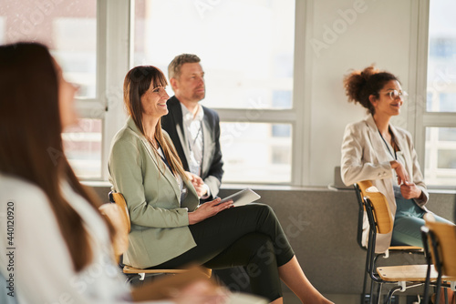 Entrepreneurs attending training class in conference centre at office