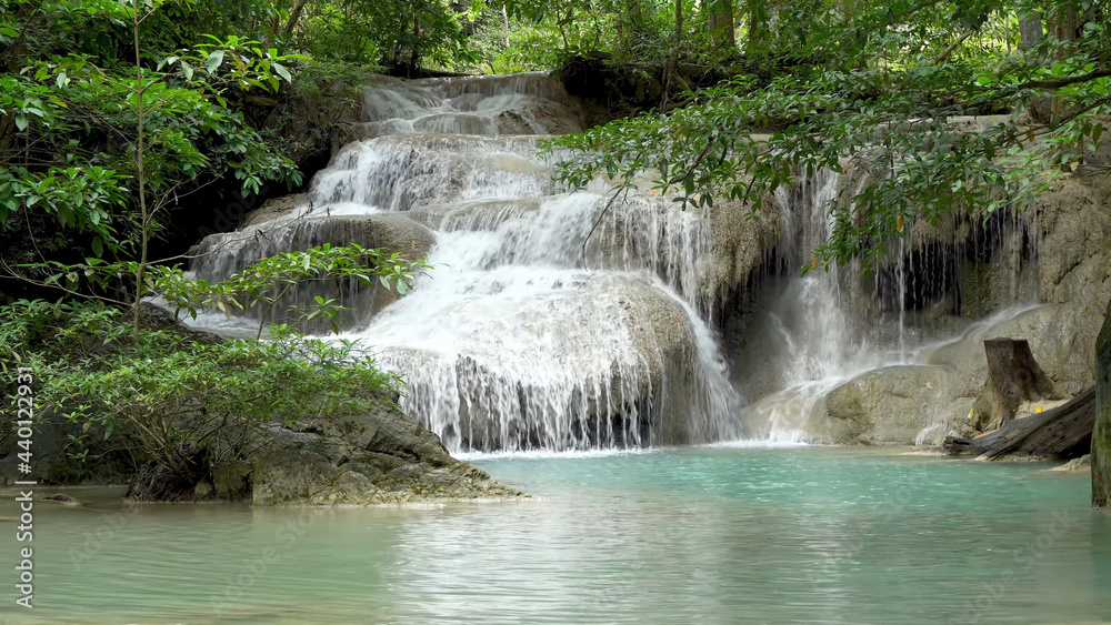 Fototapeta premium The unique beauty of the mountains with a waterfall.