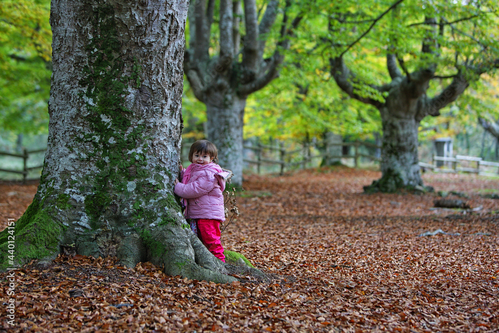 Girl leaning on tree trunk at Gorbea Natural Park Girl leaning on tree trunk at Gorbea Natural Park