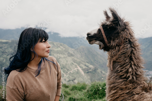 Woman with bangs looking at Alpaca