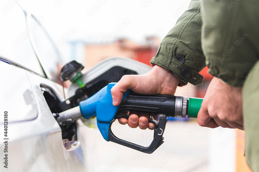 Man refueling car at gas station Man refueling car at gas station