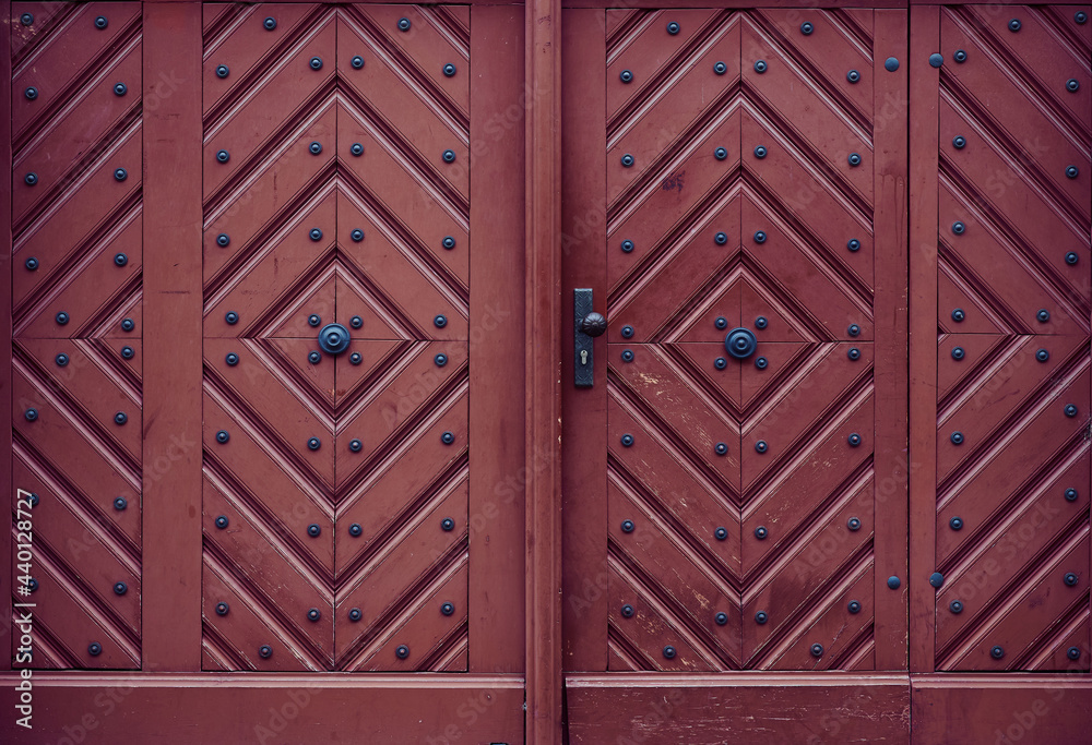 old red brown wooden front door, frame filling as background photo with copy space old red brown wooden front door, frame filling as background photo with copy space