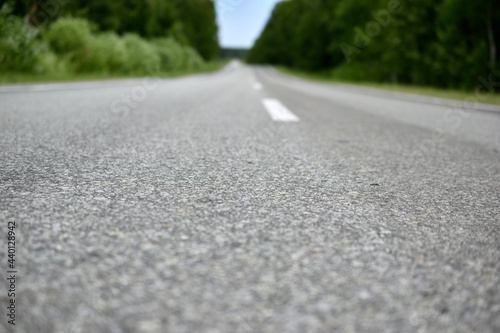 High-speed asphalt highway in the forest during the day