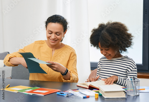 Professional child's psychologist working with an autistic girl child uses psychological session. Art psychotherapy session for autism