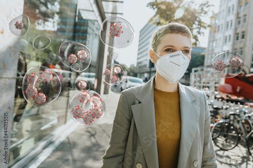 Woman with protective face mask amidst COVID-19 virus in city photo