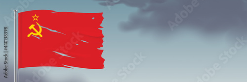 Soviet Union worn flag waving on a dark sky background. USSR flag horizontal banner with copy space. photo