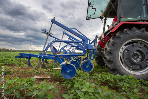 Tractor in soy field in spring