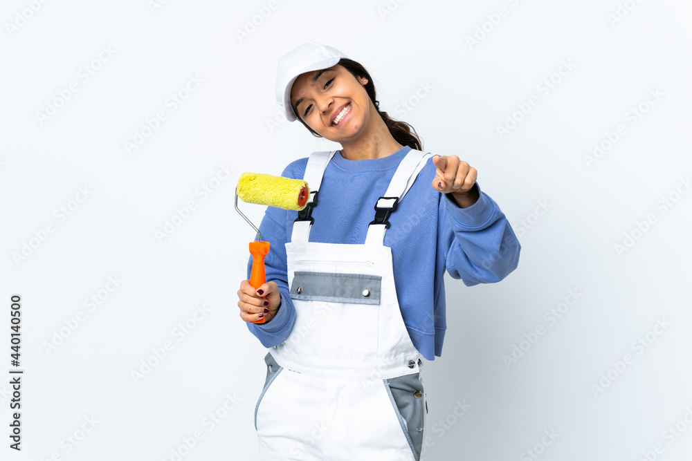Painter woman over isolated white background pointing front with happy expression Painter woman over isolated white background pointing front with happy expression