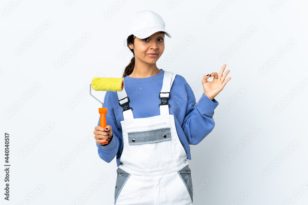Painter woman over isolated white background in zen pose Painter woman over isolated white background in zen pose