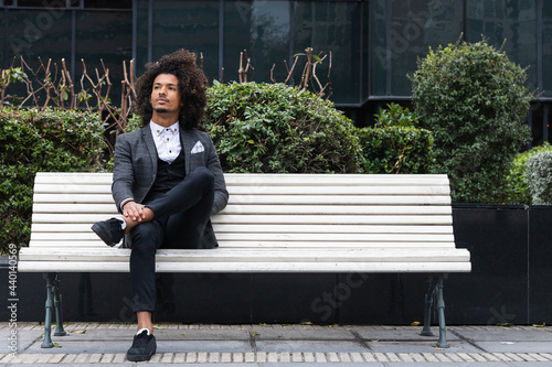 Contemplative male entrepreneur sitting on bench
