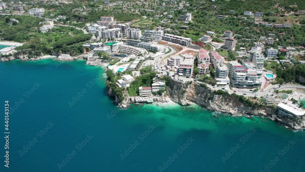 Aerial view of beautiful costal shore with luxury resorts in Vlore, Albania, a popular summer vacation destination on Adriatic sea Aerial view of beautiful costal shore with luxury resorts in Vlore, Albania, a popular summer vacation destination on Adriatic sea