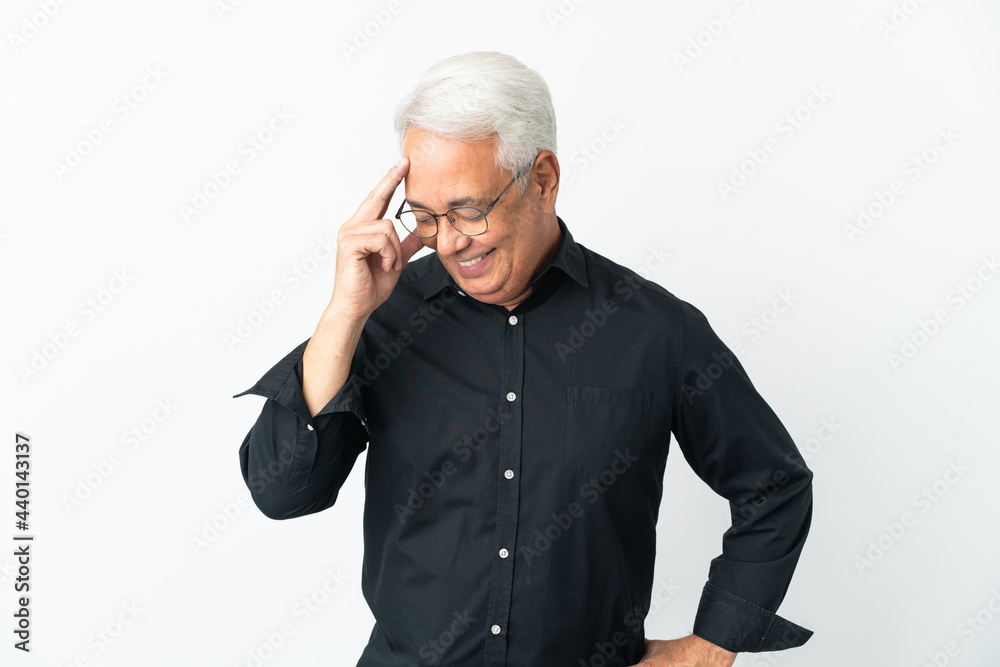 Middle age Brazilian man isolated on white background laughing