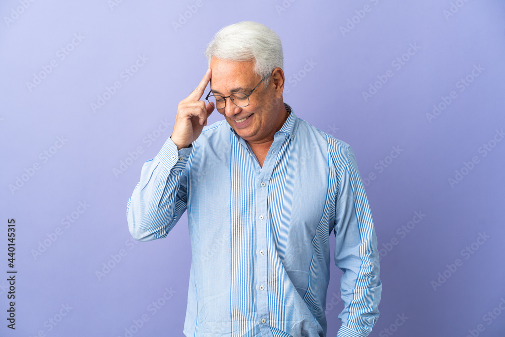 Middle age Brazilian man isolated on purple background laughing Middle age Brazilian man isolated on purple background laughing