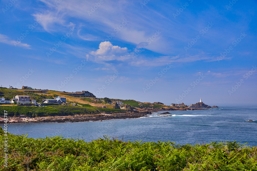 Image of Petit Port Bay with Corbiere Lighthouse in the background. Jersey CI