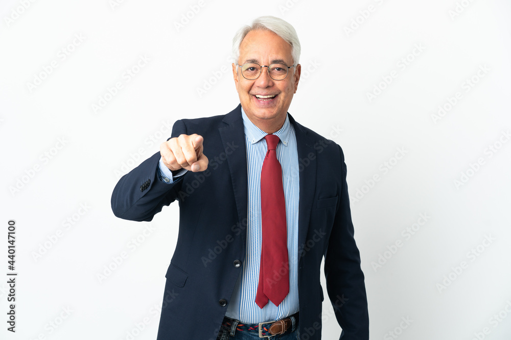 Middle age Brazilian business man isolated on white background surprised and pointing front Middle age Brazilian business man isolated on white background surprised and pointing front