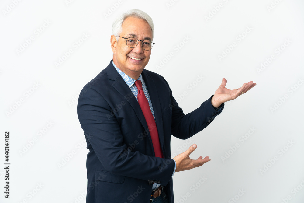 Middle age Brazilian business man isolated on white background extending hands to the side for inviting to come Middle age Brazilian business man isolated on white background extending hands to the side for inviting to come