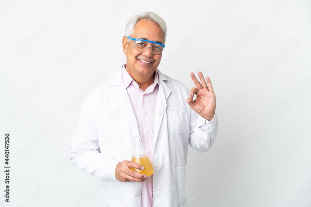 Middle age Brazilian scientific man scientific isolated on white background showing ok sign with fingers Middle age Brazilian scientific man scientific isolated on white background showing ok sign with fingers