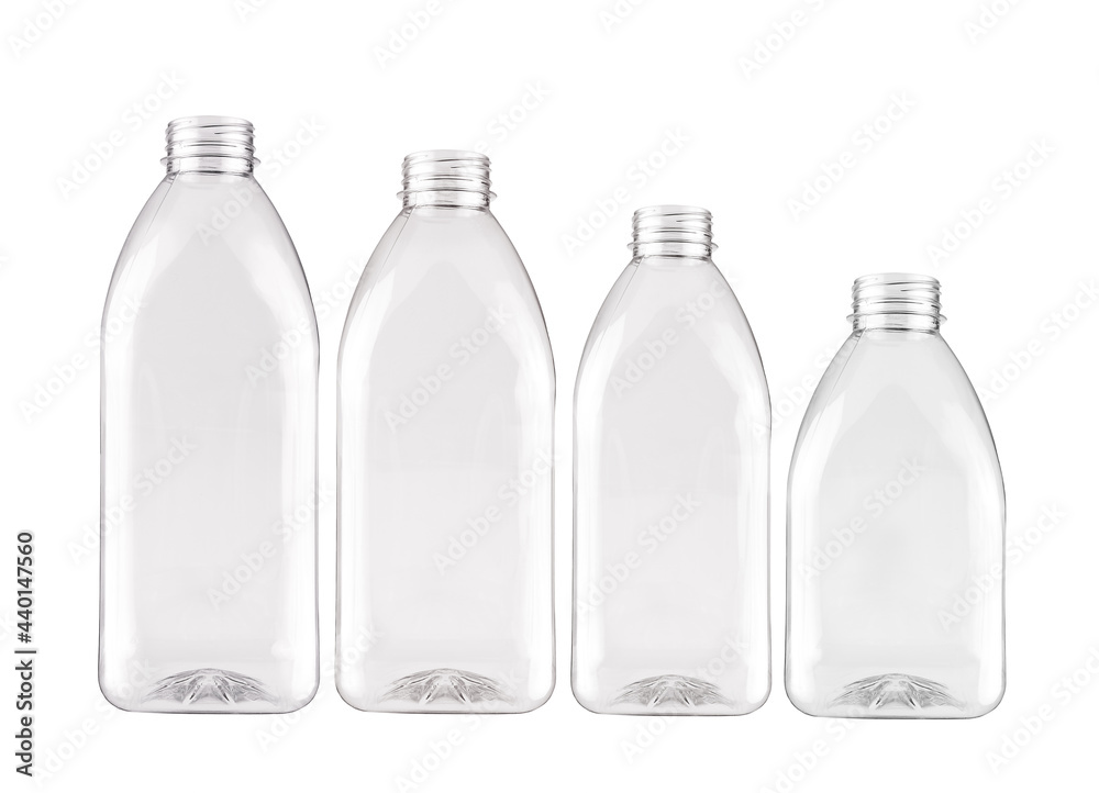 A group of identical plastic bottles of different sizes, isolated on a white background. A group of identical plastic bottles of different sizes, isolated on a white background.